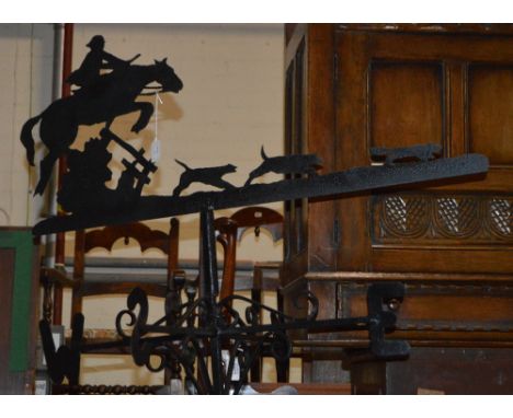 A wrought iron weather vane with cut card work hunting scene to top, height of central stem 99cm.