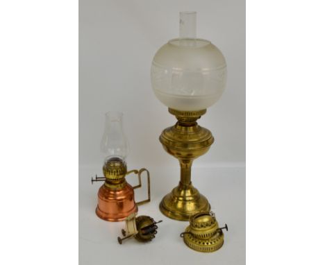 A late Victorian brass oil lamp with fluted stem above stepped circular base, with globular clear and frosted glass shade etc