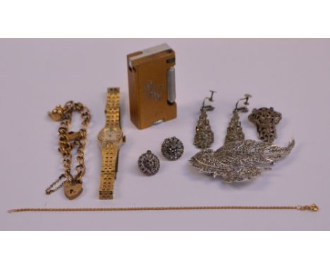 A 9ct yellow gold charm bracelet with heart shaped padlock suspending three gold charms, and a further 9ct gold rope twist li