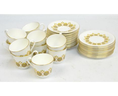 A Royal Doulton part tea service in Polonaise H5017 pattern comprising twelve tea plates, eleven cups and twelve saucers.