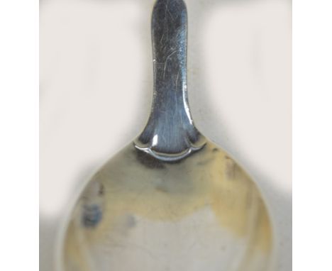 GEORG JENSEN; a hallmarked silver shallow sauce ladle, pattern no.21 with beaded loop foliate handle and oval bowl, full hall