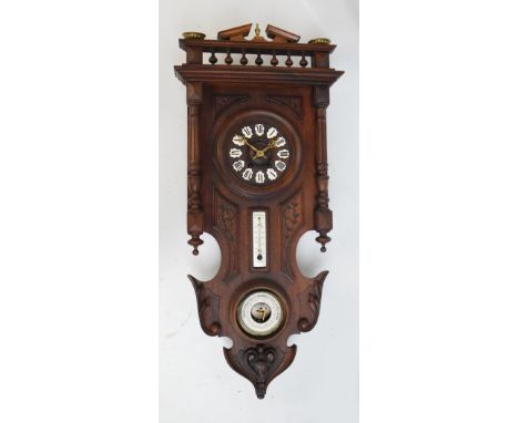 A c.1900 oak cased combination wall clock, thermometer and barometer, with Roman numerals to the enamel hour points, length 9