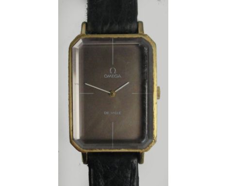 OMEGA; a gold plated cased manual wind Omega De Ville lady's wristwatch, the rectangular dial with canted corners and thick b