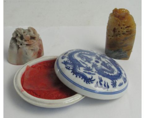 A Chinese soapstone seal, carved with dragon and pearl of wisdom amongst clouds on wave decorated base, height 5.5cm, and a f