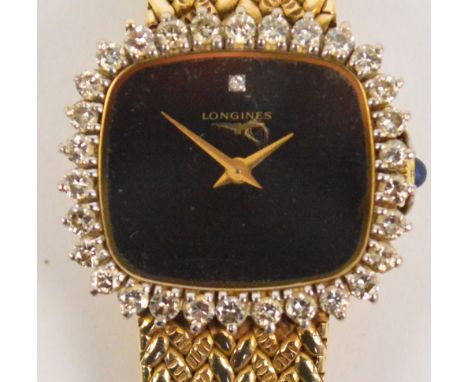 LONGINES; a 14ct yellow gold cased manual wind lady's wristwatch, the rectangular rounded dial set with small diamond, within