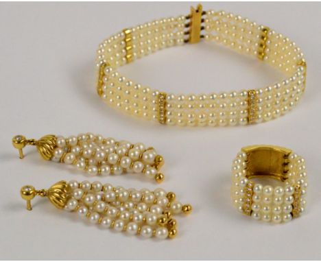 A suite of 18ct yellow gold cultured pearl and diamond set jewellery comprising a four strand bracelet set with six diamond s