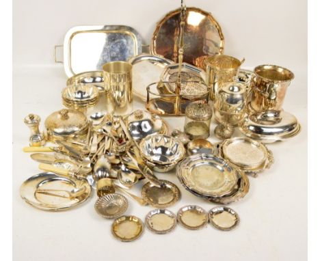 A quantity of electroplated items including a twin section bottle holder, a twin handled tray, salver, teapot, flatware, muff
