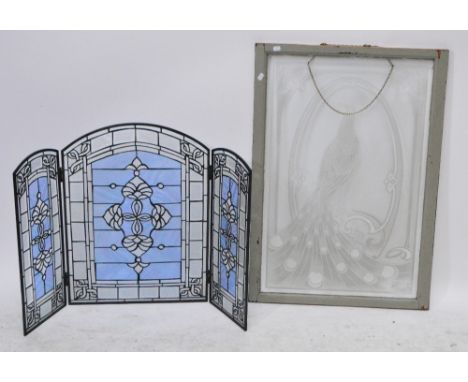 A reproduction stained glass two fold fire screen and a 19th century rectangular glass panel depicting a peacock, 90 x 59.5cm