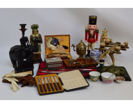A mixed lot of various collectors' items including an ebonised carving of an elephant, an antler candelabrum, an oak barleytw