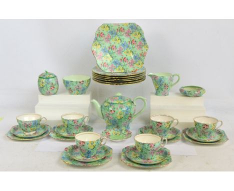 A Shelley "Melody" pattern tea service, comprising teapot, sugar bowl, jug, preserve pot and cover, ashtray, butter dish, bre