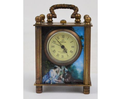 OMEGA; a modern miniature carriage clock, the circular dial set with Roman numerals with transfer decorated glass sides, heig