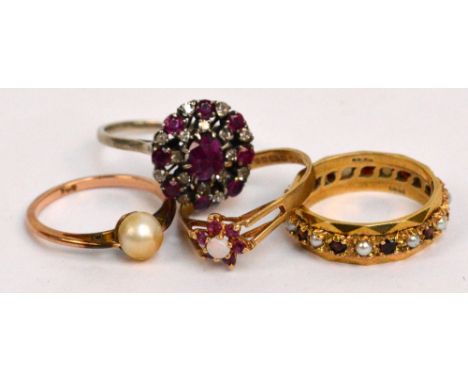 Three 9ct yellow gold rings to include a garnet and seed cultured pearl eternity within faceted borders, size N, and a white 