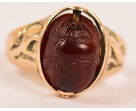 A 9ct yellow gold signet ring set with oval swivel carnelian intaglio to one side and with scarab to the other (af), size M, 