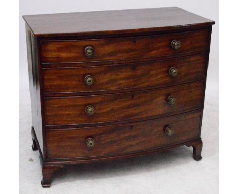 An early 19th century mahogany bowfronted chest of four long graduated drawers raised on ogee bracket feet, width 114cm.