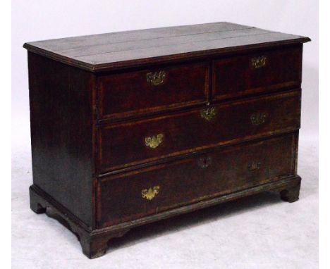 A George III oak and crossbanded chest of two short and two long drawers raised on bracket feet, for restoration, width of as