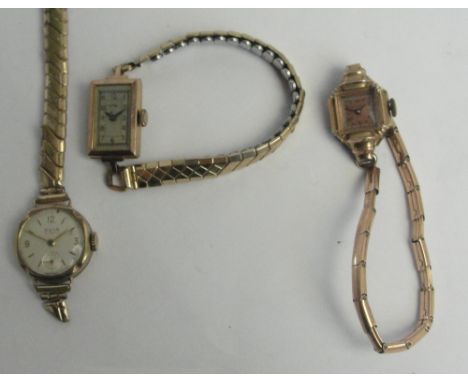 DOMINANT; a 1930s 9ct rose gold manual wind lady's cocktail wristwatch, the rectangular dial set with Arabic numerals, case h