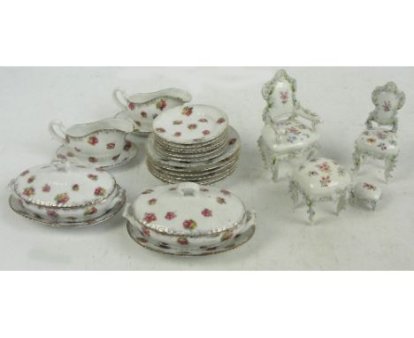 A child's or doll's part dinner service comprising six dinner plates, six smaller plates, two lidded tureens and two sauce bo