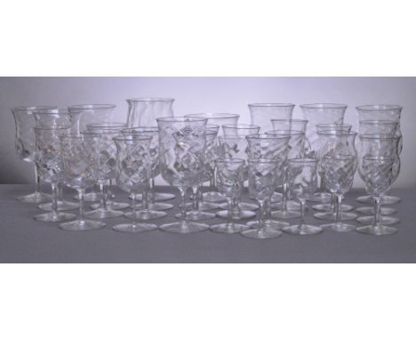 JAMES POWELL WHITEFRIARS; a harlequin suite of glass, each piece with dimpled rounded square section bowls with plain stems a