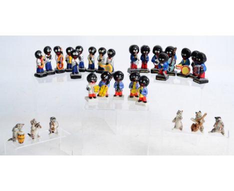 Three sets of Robertson Gollies jazz bands and a ceramic six piece cat band.