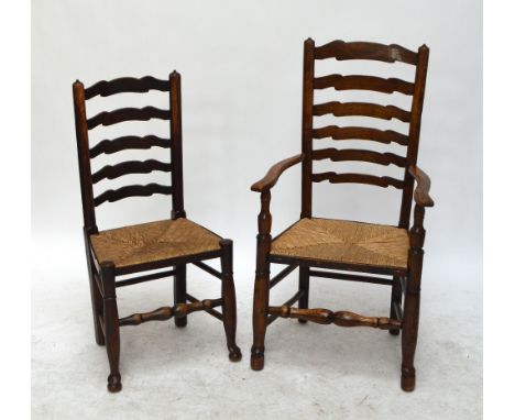 A harlequin set of eight 19th century oak and ash wavy ladder back Countrymade dining chairs each with rush seat, turned fron