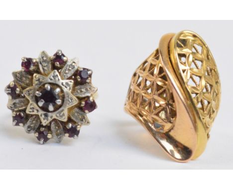 UNGARI; a yellow metal pierced abstract design ring, size L and an 18ct floral set ring, size M, combined approx 13.4g (2). C