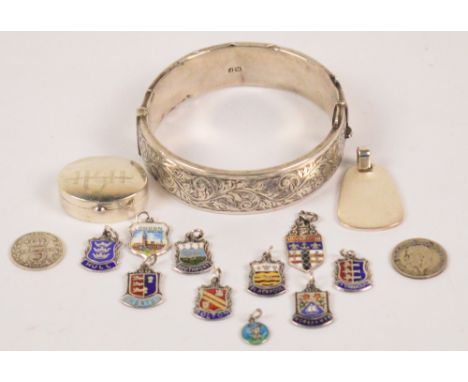 A small quantity of jewellery comprising an Elizabeth II hallmarked silver snap bangle with bright cut decoration, Smith and 