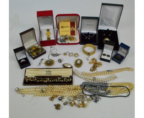 A collection of costume jewellery including various simulated pearl necklaces, gold plated and yellow metal mounted brooches,