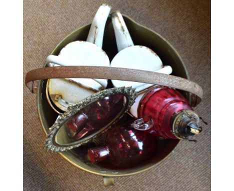 Two white enamelled vintage watering cans, a brass jam pan with loop handle, a mirror and a cranberry tinted and clear glass 