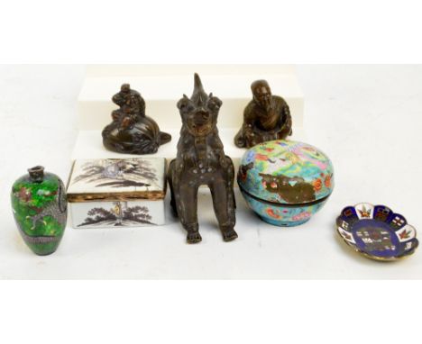 A late 19th century Sino-Tibetan model of a stylised dog, a pair of bronzed weights, a circular enamel trinket box (af), a cl