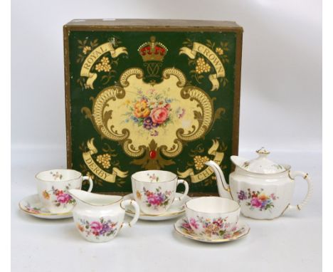 A boxed Royal Crown Derby "Posies" tête-à-tête tea set comprising teapot, sugar bowl, cream jug and two cups and saucers.