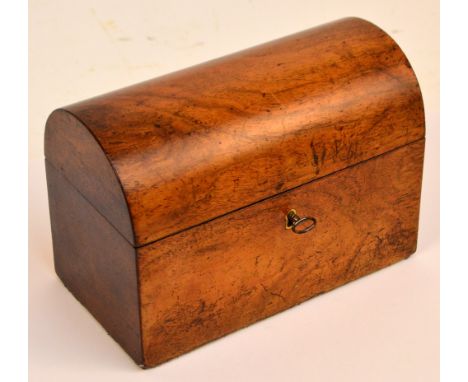 A Victorian walnut tea caddy of rectangular form with domed hinged lid enclosing two lidded compartments, 21 x 11 x 15cm, wit