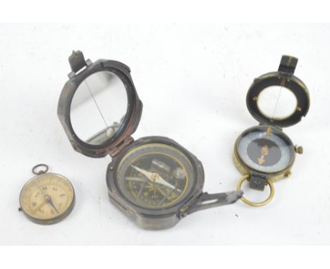 A Verner's military issue compass, WWI period, dated 1916, a further pocket compass and a reproduction pocket compass (3).