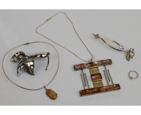 A group of costume jewellery comprising a very large white metal and purple glass pendant by Elly-Asgona, a further opalescen
