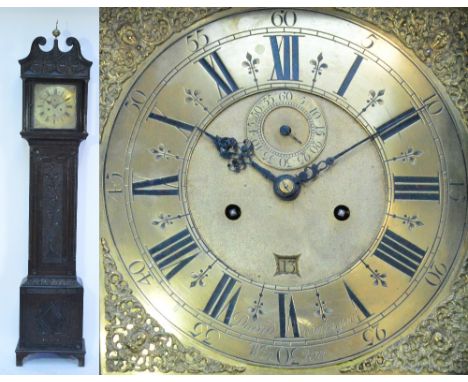 A Georgian and later carved oak longcase clock, the 12" brass dial set with Roman numerals to the chapter ring, eight day mov