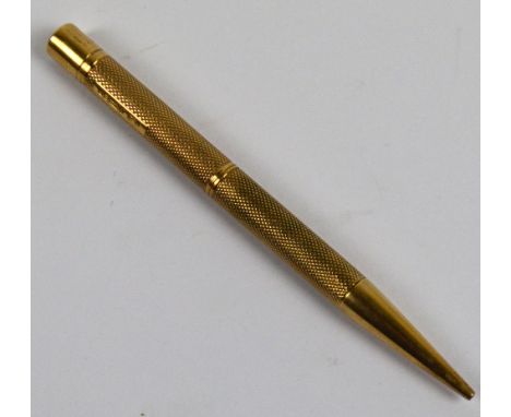A 9ct yellow gold Baker's perm-point propelling pencil with overall engine turned decoration, length 11cm, approx 24.7g.