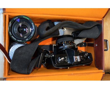 A cased Cosina CS-2 camera with accessories.