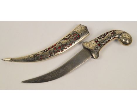 A late 19th/early 20th century Eastern and white metal niello decorated dagger with pierced plush lined handle and scabbard d