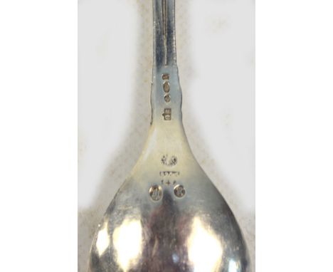 GEORG JENSEN; a hallmarked silver fruit spoon, pattern no.148, with pierced acanthus scroll and grape finial and rounded bowl
