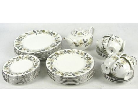 A quantity of Wedgwood dinner and tea ware in "Beaconsfield" pattern comprising seven dinner plates, seven dessert plates, ei