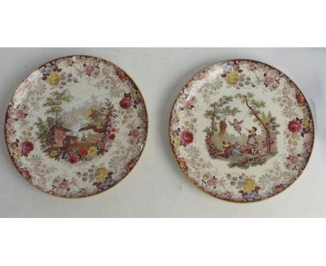 A pair of 19th century Mintons ceramic circular chargers with transfer and later and hand coloured decoration, one depicting 