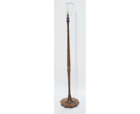 A turned beech standard lamp.