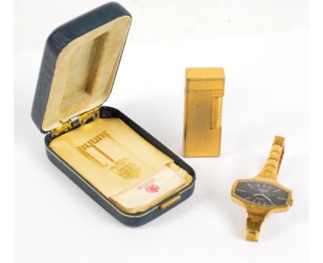 TISSOT; a gold plated stainless steel lady's wristwatch, the oblong tonneau dial set with baton numerals, also a boxed gold p