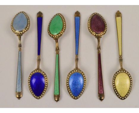 A set of six sterling silver and enamel decorated teaspoons, each front and reverse decorated with a different coloured ename