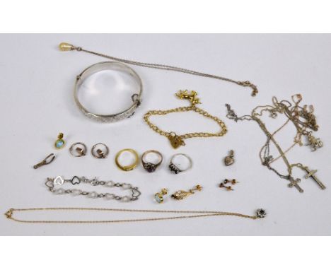 A small group of jewellery comprising a 9ct yellow gold kerb link charm bracelet with heart shaped padlock, suspending a unic