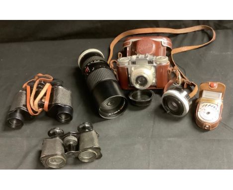 Photography - a Pentax MV 1 SLR 35mm camera; a Braun Paxette, 35mm camera; Voigtländer Bessa folding concertina camera, brown