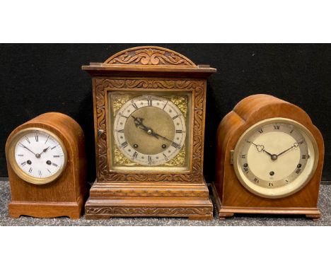 An early 20th century oak cased mantel clock, Roman numerals to dial, twin winding holes, 34cm high; an Elliot clock, Roman n