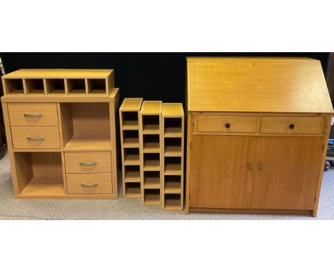 A 1970’s oak bureau, fall top with shelf to interior, over two short drawers, and pair of cupboard doors, 107cm high x 92cm w