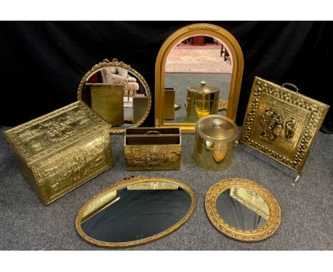 A brass fuel bin, with panels in relief, Dutch coastal scenes, a similar fire screen, magazine rack;  arch-top wall mirror, g
