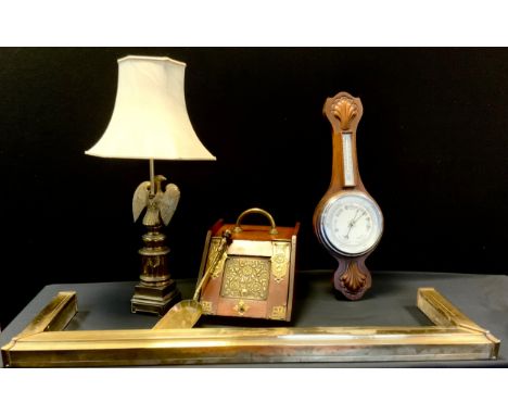 A 19th century Aesthetic movement brass inset mahogany coal purdonium;  brass fender;  eagle table lamp;  oak aneroid baromet