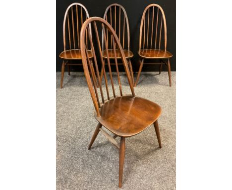 A set of four Ercol ‘Quaker’ design, elm spindle-back chairs, 96cm high, (4). 